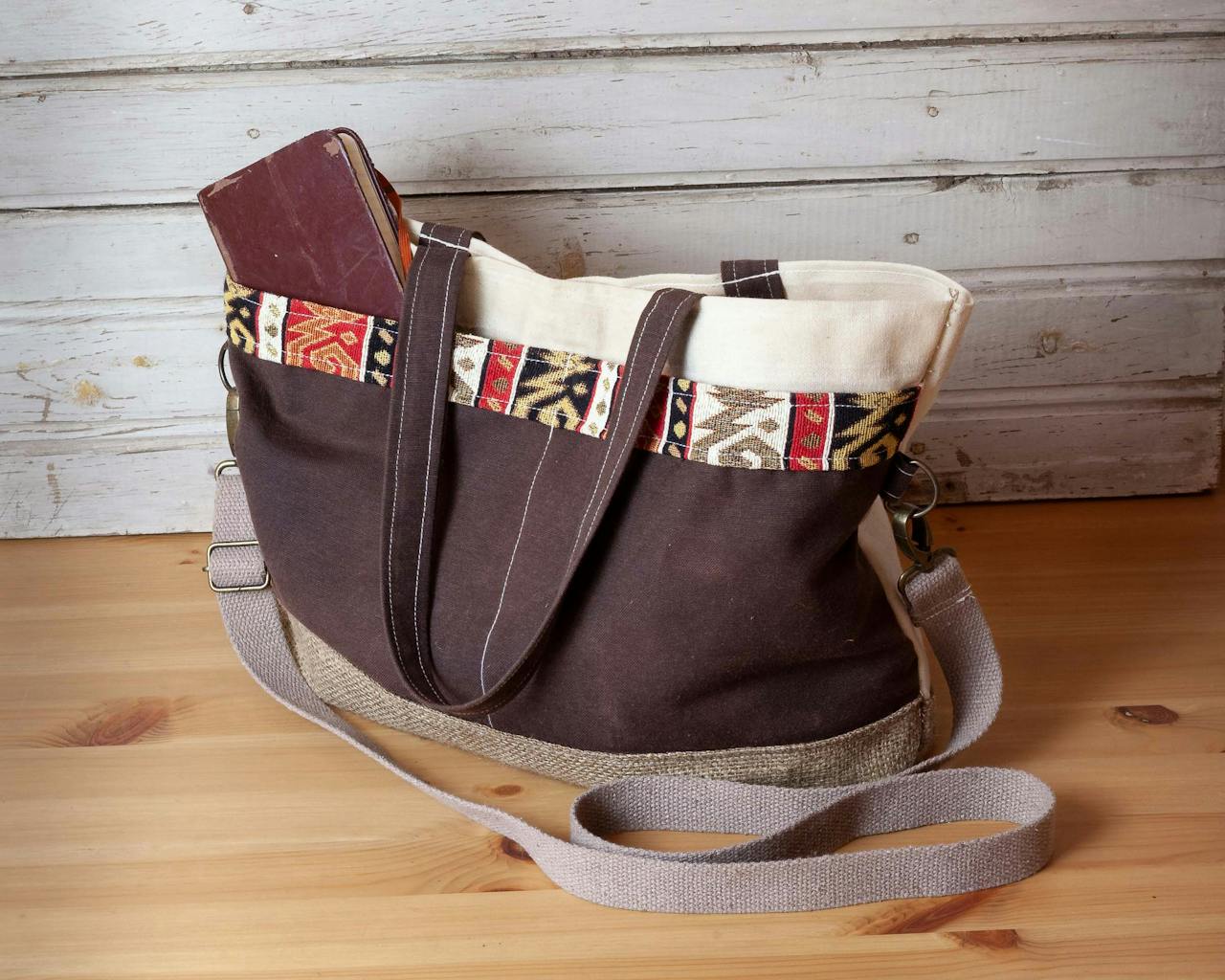 Handmade tote bag with ethnic patterns on a wooden surface, perfect for casual outings.